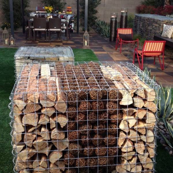 Fill timber logs into the gabion basket for landscaping.