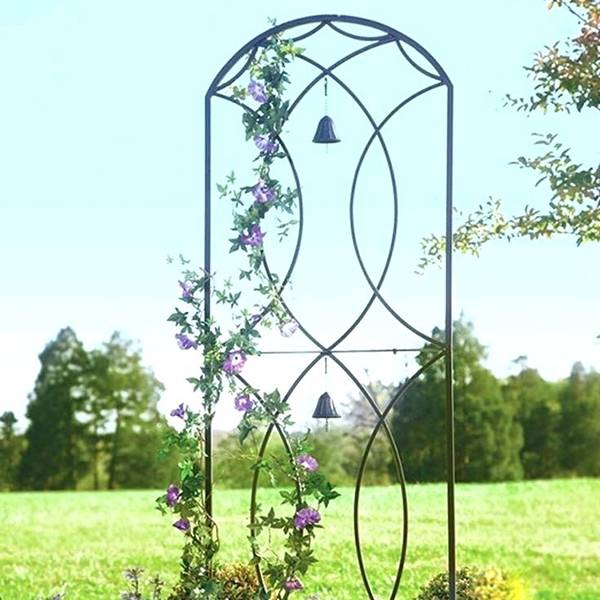 Arch shaped metal garden trellis with black bells for climbing flowers.