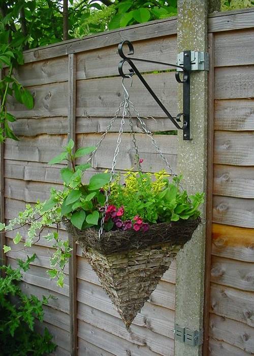 Plant bracket hanging a cone potted flower.