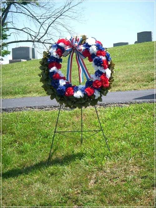 The round funeral floral is arranged with wire wreath stand.