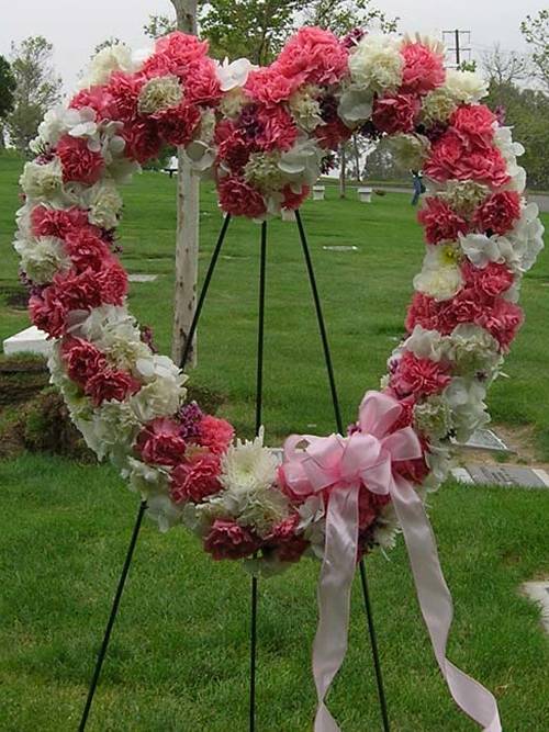 The heart floral is arranged with wire wreath stand.