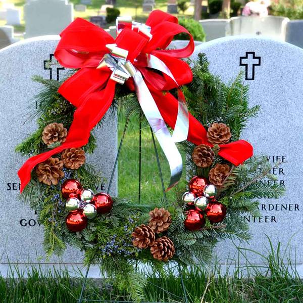 Lay Christmas wreaths for the departed loved ones.